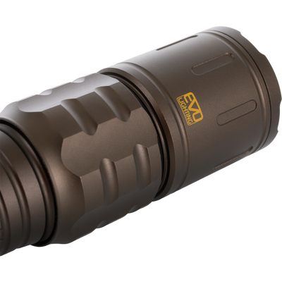 Close-up of Lumen Flashlight EVO1000 showcasing its grooved anodized aluminum body, O-ring seal, and EVO Lighting logo, highlighting durability and versatility for outdoor use.