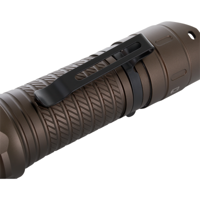 Close-up of the Lumen Turbo Flashlight EVO2200, showing its knurled bronze grip and black pocket clip, highlighting rugged, durable design for high-performance lighting.