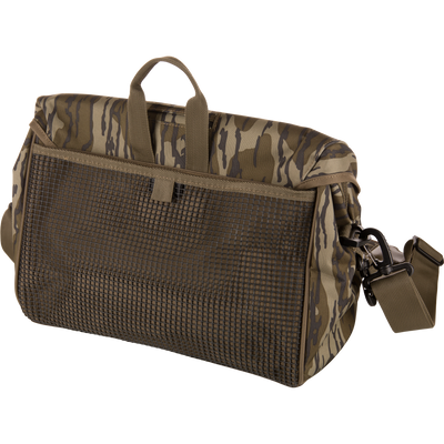 Hardline Shoulder Blind Bag in tiger-stripe camouflage with mesh front flap, top grab-handle, and adjustable shoulder strap, designed for durable, waterproof hunting gear storage.