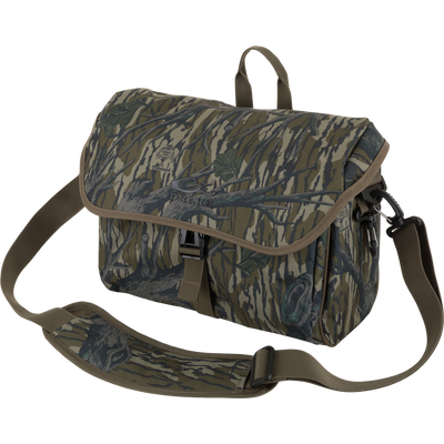 Hardline Blind Bag with camouflage pattern, adjustable strap, quick-release buckles, and embossed Drake logo, designed for durable, weather-resistant waterfowl hunting gear storage.