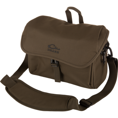 Olive-green Hardline Blind Bag by Drake, featuring a logoed flap, quick-release buckle, and padded shoulder strap, designed for waterfowl hunting durability and weather protection.