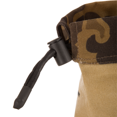 Close-up of the Waxed Canvas Shell Pouch, featuring a camo pattern and drawstring closure with a visible roll of “GAFF” gaffer’s tape inside.