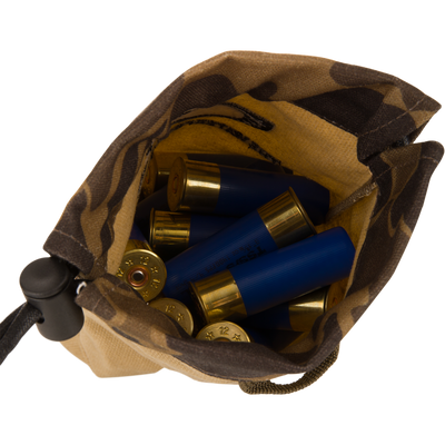 Waxed Canvas Shell Pouch holds blue-hulled, 12-gauge shotgun shells, showcasing its durable, waterproof waxed cotton design ideal for outdoor use.
