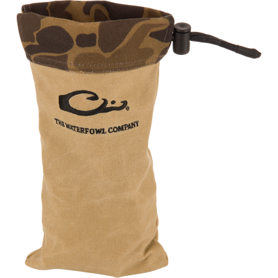 Waxed Canvas Shell Pouch with camo-pattern cuff, black cord lock, and The Waterfowl Company logo, designed for rugged, waterproof outdoor use and durability.
