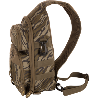Hardline Sling Pack in tiger-stripe camouflage, featuring MOLLE webbing, durable fabric, adjustable strap, and multiple zippered compartments for versatile outdoor and urban use.