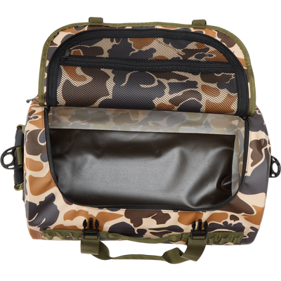 Waterproof Duffel Bag with camo pattern, open to show empty main compartment and zippered mesh pocket under lid; features durable handles and front plastic buckles.