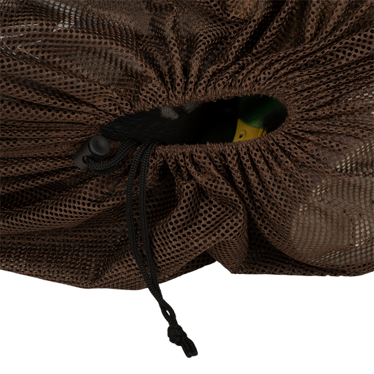 Texas Rig Mesh Decoy Bag: Durable mesh bag with hole, black string, and rope. Includes yellow and green rubber duck. Perfect for storing and transporting decoys.