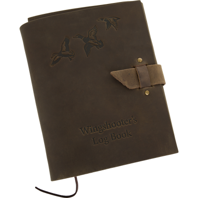 Drake Leather Wingshooters Hunting Log with embossed waterfowl design, leather strap closure, and bookmark ribbon for detailing waterfowl hunts. Features durable leather and high-quality paper.