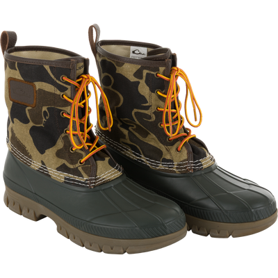 Throwback 80 Waxed Canvas Lace Up Duck Boot with camo-patterned canvas upper, waterproof rubber bottom, and bright laces, designed for durability and comfort in rugged outdoor conditions.
