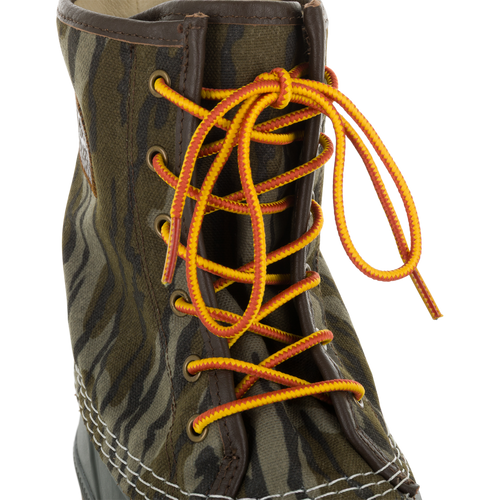 Throwback 80 Waxed Canvas Lace Up Duck Boot with camouflage pattern, brown leather trim, and yellow-orange laces, ideal for rugged outdoor use.