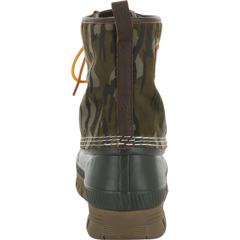 Throwback 80 Waxed Canvas Lace Up Duck Boot with camouflage canvas, leather pull tab, green rubber bottom, and treaded outsole, ideal for rugged outdoor use.