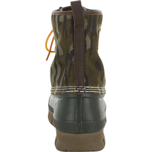 Throwback 80 Waxed Canvas Lace Up Duck Boot with camouflage canvas, leather pull tab, green rubber bottom, and treaded outsole, ideal for rugged outdoor use.