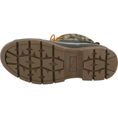 Throwback 80 Waxed Canvas Lace Up Duck Boot sole, showcasing lugged tread pattern, with glimpses of camouflage upper and orange laces, highlighting durability and water-resistance.