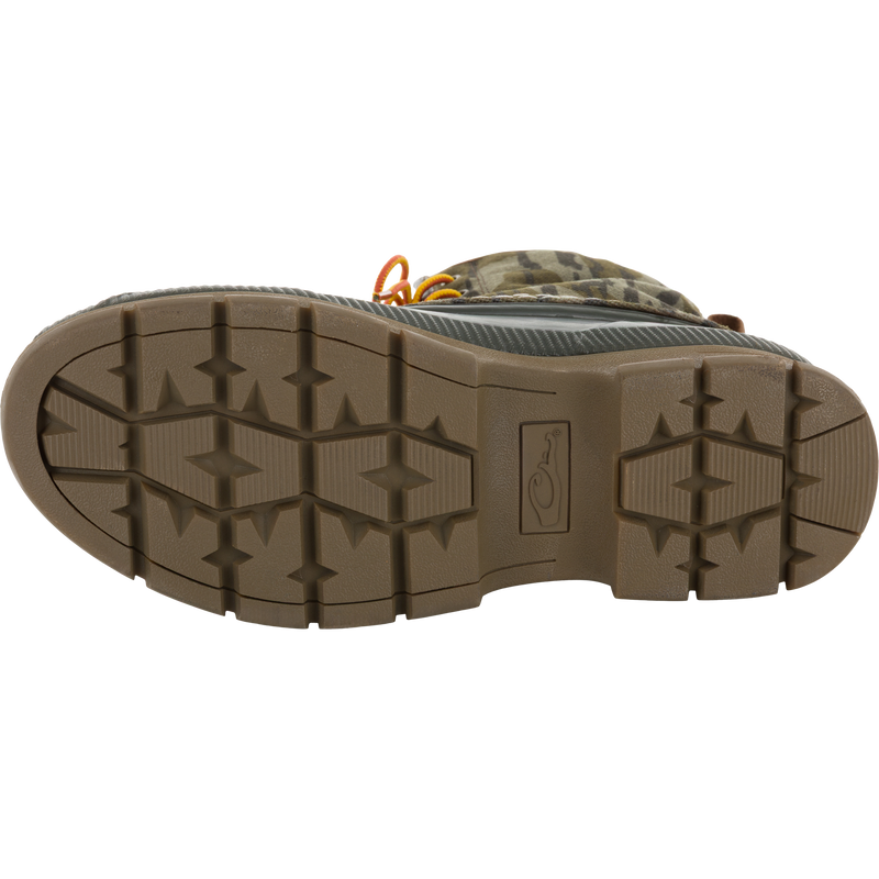 Throwback 80 Waxed Canvas Lace Up Duck Boot sole, showcasing lugged tread pattern, with glimpses of camouflage upper and orange laces, highlighting durability and water-resistance.
