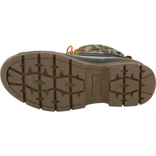 Throwback 80 Waxed Canvas Lace Up Duck Boot sole, showcasing lugged tread pattern, with glimpses of camouflage upper and orange laces, highlighting durability and water-resistance.
