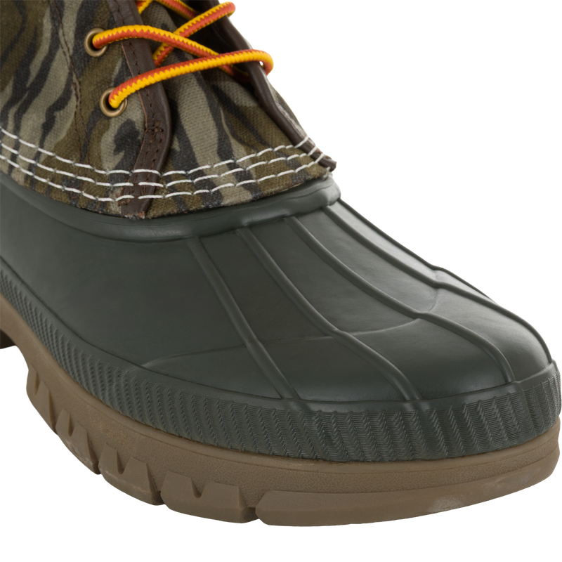 Throwback 80 Waxed Canvas Lace Up Duck Boot with camo-patterned upper, orange-and-yellow laces, and waterproof rubber bottom, ideal for rugged outdoor wear.