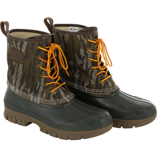 Throwback 80 Waxed Canvas Lace Up Duck Boot with waterproof rubber bottom, camo-print canvas upper, yellow-and-orange laces, ideal for wet and rugged outdoor conditions.