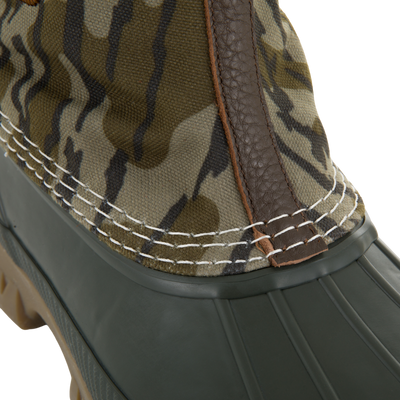 RTL - Throwback 80 Waxed Canvas Slip On Duck Boot featuring camo upper, olive rubber lower, leather seam, and durable waterproof design with removable insole for comfort.