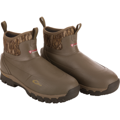 BMF1600 17 Rubber Boot with Primaloft Insulation; slip-on, rugged boots with camo collar, lugged soles, and gusseted back for optimal fit in hunting conditions.