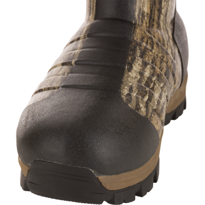 EST Uninsulated 16 Hybrid Mudder Boot 3.0 close-up, showcasing black rubber toe cap and camouflage upper, designed for durability and comfort in rugged environments.