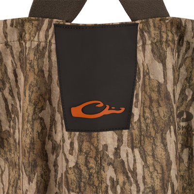 Hardline Uninsulated Breathable Wader with camo pattern, featuring a black reinforced front panel with orange logo, and adjustable shoulder straps for outdoor hunting adventures.