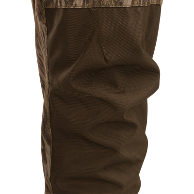 Close-up of Hardline Breathable Youth Wader's reinforced, textured ankle, highlighting durable, waterproof fabric and precise stitching, ideal for young outdoor enthusiasts.