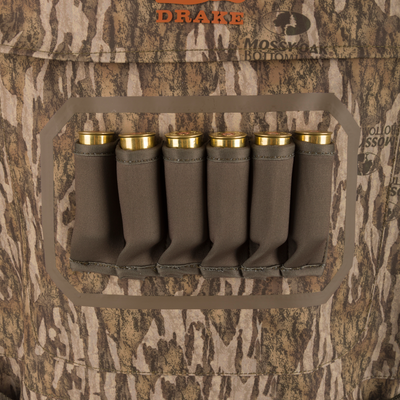 Drake's Hardline Breathable Youth Wader with Mossy Oak camo features elastic shell loops, showcasing six secured shotgun shells for hunting convenience.