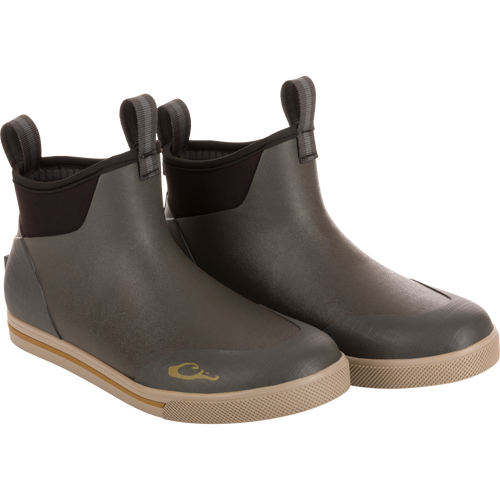 Camp Deck Boot, waterproof ankle-height with olive-green textured rubber, elasticized black ankle, pull tabs, and non-marking siped outsole for superior traction on wet surfaces.
