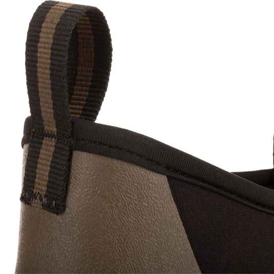 Camp Deck Boot close-up showing textured rubber lower and neoprene upper with striped pull-tab, highlighting its waterproof design and superior traction for outdoor adventures.