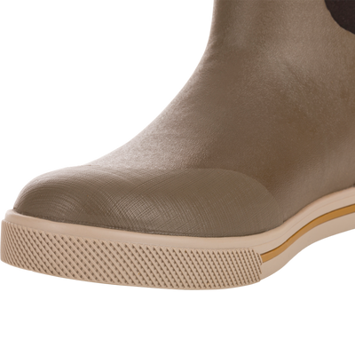 Close-up of Camp Deck Boot showcasing its light brown molded rubber toe and textured sole, highlighting waterproof construction and superior traction ideal for outdoor adventures.