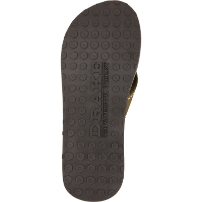 Underside of Lake Shore Flip Flops with black honeycomb tread, embossed with “DRAKE” and “The Waterfowl Company,” designed for outdoor and water adventures.