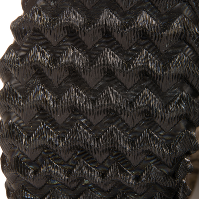 Close-up of the embossed chevron pattern on the Hardline Insulated Breathable Wader, showcasing its durable, waterproof material designed for outdoor adventures.