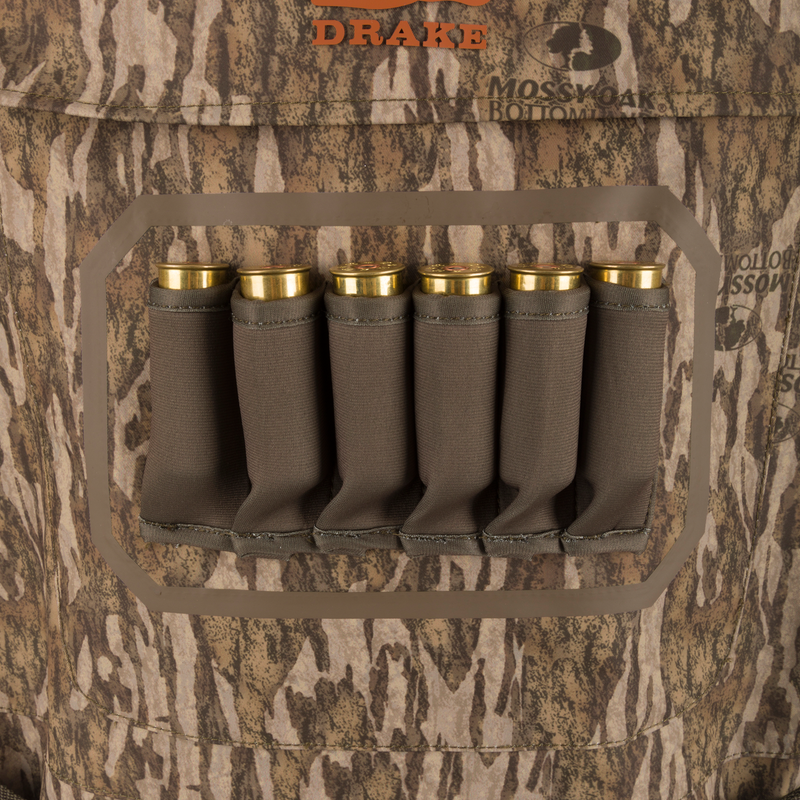 Hardline Insulated Breathable Wader with elastic shell holder, six shotgun shells, Mossy Oak camo pattern, and “DRAKE” logo, showcasing durable, insulated hunting gear.