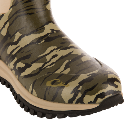 Close-up of Offroad Rubber Deck Boots' camouflage-patterned toe, featuring lugged sole, designed for waterfowl hunting with waterproof construction and Vibram® outsole.