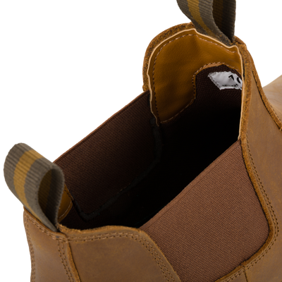 Close-up of the opening of a Lifestyle Leather Camp Deck Boot with brown elastic side panels and striped pull tabs.