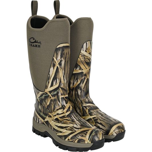 The Waterfowl Uninsulated 16″ Camp Boot features a neoprene upper, rugged rubber outsole, side pull loops, and a Mossy Oak Original Shadow Grass camo pattern for durable waterproof protection.