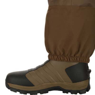 EST Waterfowler’s Hip Boot designed for marsh navigation, featuring GE3 Wader Material, athletic lug outsole, EVA midsole, and adjustable hip strap for comfort and traction.