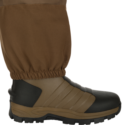 EST Waterfowler’s Hip Boot designed for marsh navigation, featuring athletic lug outsole, breathable GE3 fabric, and adjustable strap for comfort and mobility.