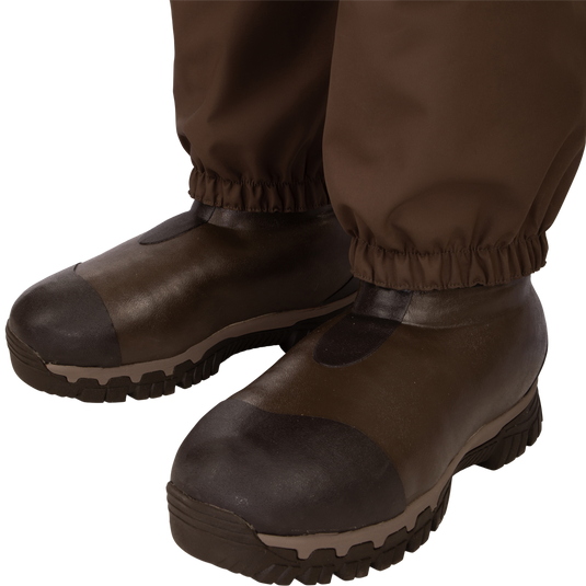 Uninsulated Guardian Elite HND Front Zip Waders - Habitat: A pair of brown boots with improved traction and cushioning, perfect for hunting in various terrains.
