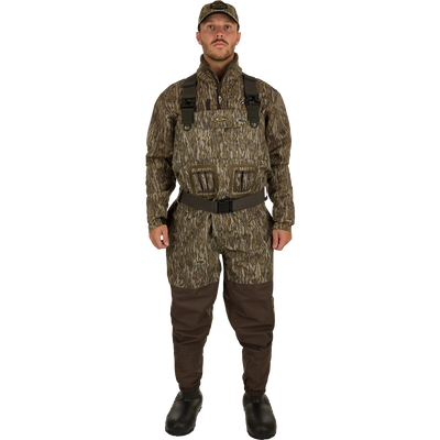 A man wearing Uninsulated Guardian Elite Vanguard Breathable Waders, standing facing front.