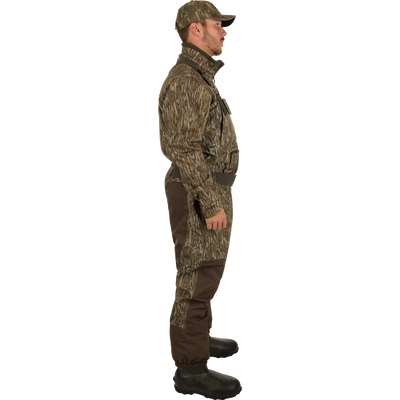 A man wearing Uninsulated Guardian Elite Vanguard Breathable Waders turned to the side.