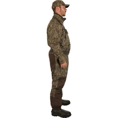 A man wearing Uninsulated Guardian Elite Vanguard Breathable Waders turned to the side.