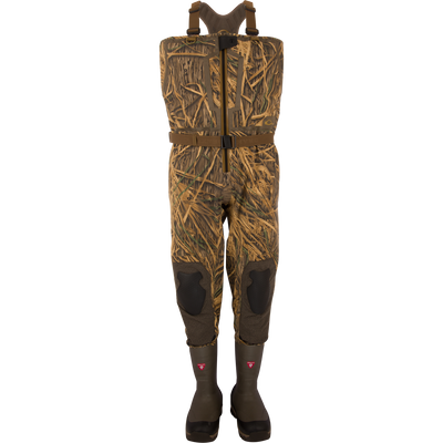 BMF1600 Kevlar Wader with Primaloft, featuring camouflage pattern, built-in rubber boots, adjustable harness, reinforced knees, and front-zip entry for waterfowl hunting.
