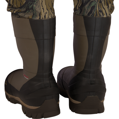 Back view of BMF1600 Kevlar Wader with Primaloft, featuring camo-patterned legs tucked into insulated rubber boots, highlighting durability and advanced construction.