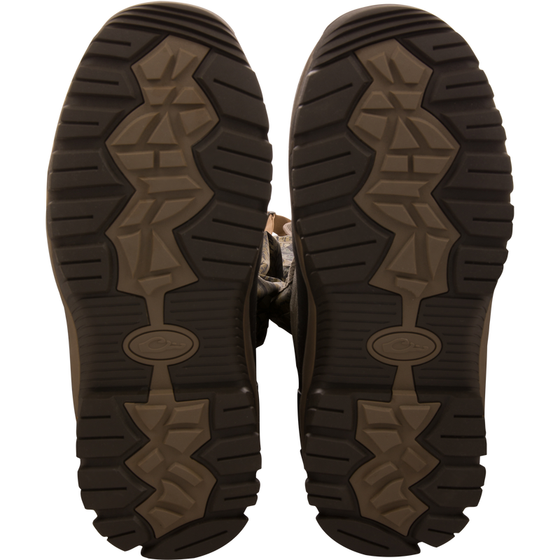 Sole-up view of BMF1600 Kevlar Wader boots, showcasing camo-patterned, heavy-tread design for superior grip and durability in hunting and outdoor activities.