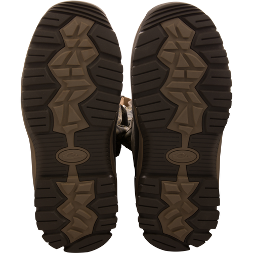 Sole-up view of BMF1600 Kevlar Wader boots, showcasing camo-patterned, heavy-tread design for superior grip and durability in hunting and outdoor activities.