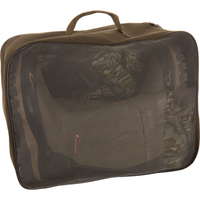 BMF1600 Kevlar Wader with Primaloft inside an olive-green travel packing cube, visible through mesh panel, showcasing its compact storage for hunting gear.