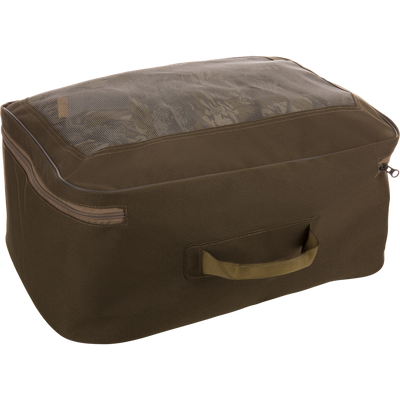 Olive-green storage cube with mesh top displaying folded garments, representing the BMF1600 Kevlar Wader's mesh carry bag inclusion for organized travel.