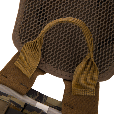 Close-up of BMF1600 Kevlar Wader's mesh-padded back panel with honeycomb ventilation and olive-drab webbing straps, highlighting durability and advanced design.