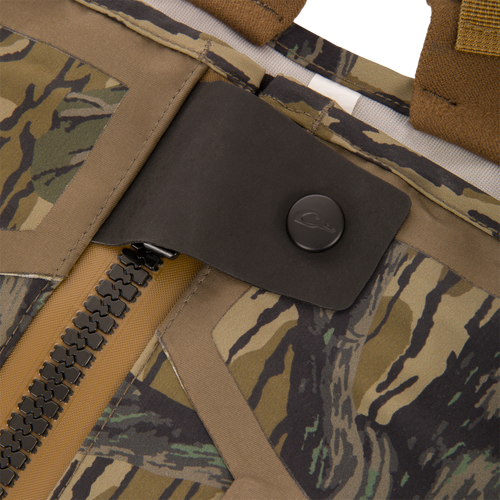 Close-up of BMF1600 Kevlar Wader with Primaloft, showcasing a tiger-stripe camo pattern and heavy-duty zipper with snap-button flap for enhanced durability and water resistance.